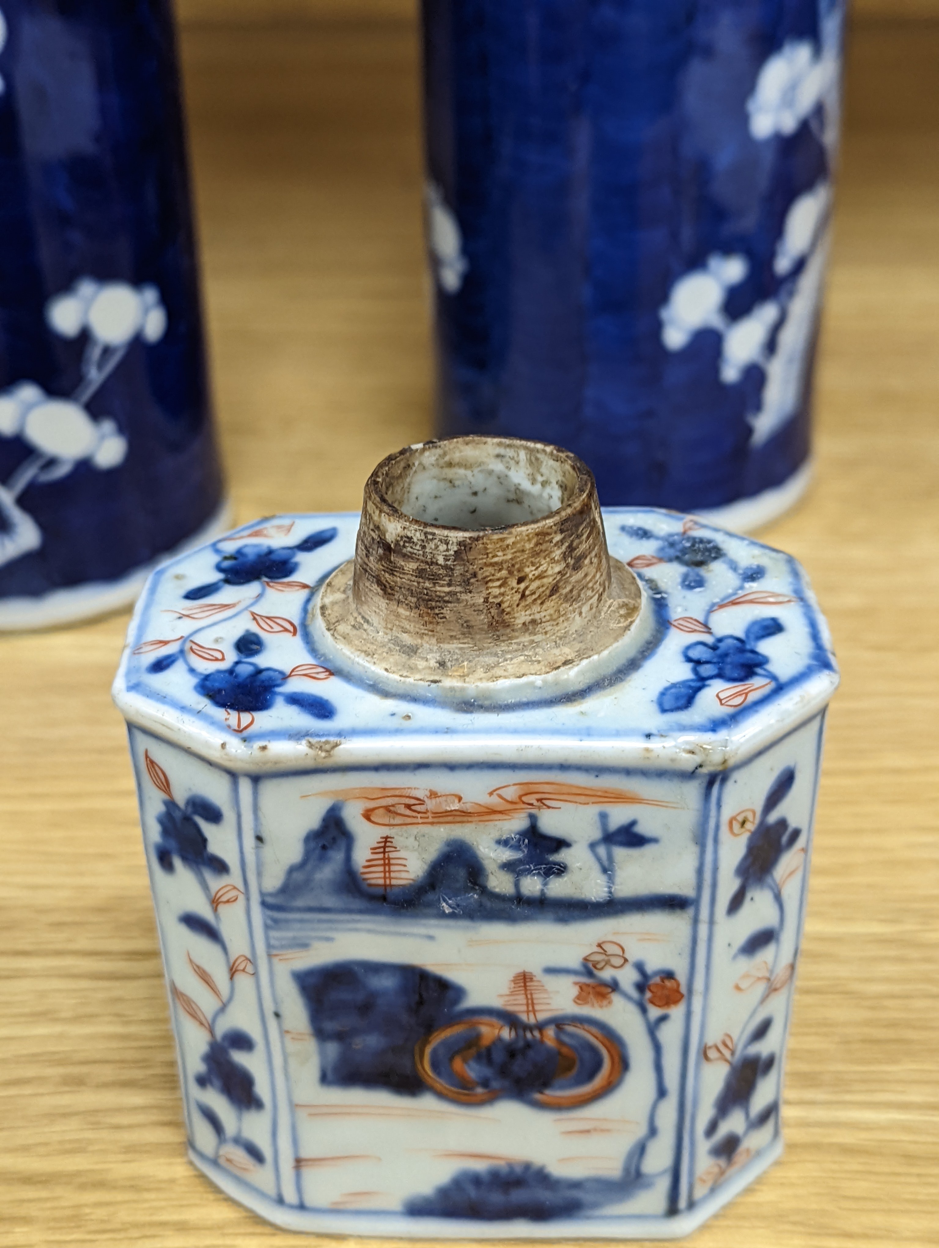 An 18th century Chinese famille rose mug, a Chinese Imari tea caddy and two Chinese blue and white sleeve vases 30cm (4)